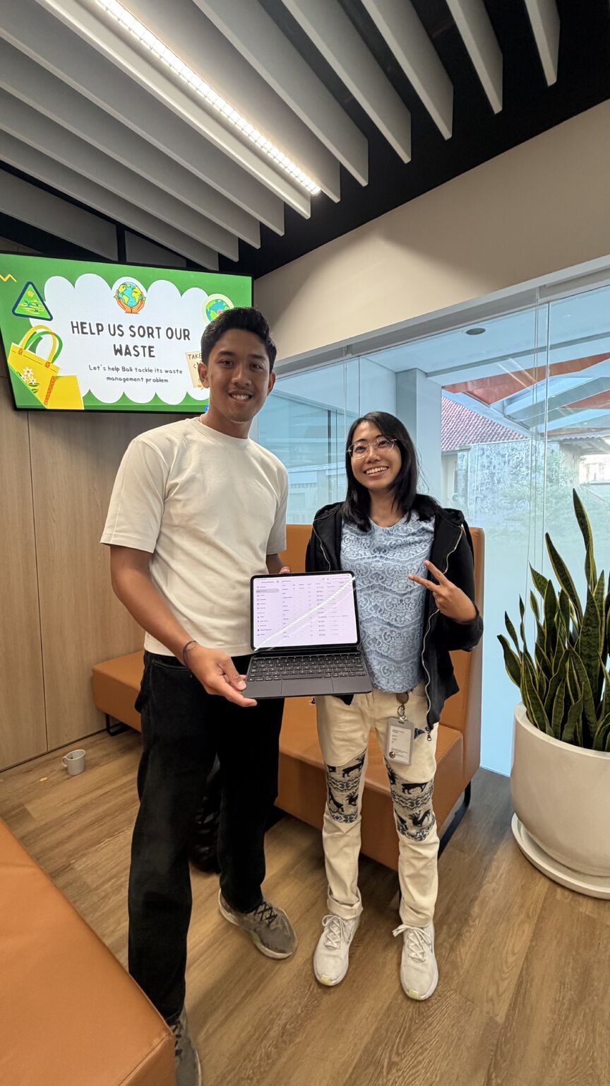 Brio presenting Kunang on an iPad with a community partner